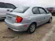 2005 Hyundai Accent GLS z VIN KMHCG35C75U354574, wystawiony jako Copart lot #74931444 z przebiegiem 141 013 mil mil oraz Szkoda całkowita • Salvage title. Historia ofert i sprzedaży dostępna na DreamBid. Obrazek 3.