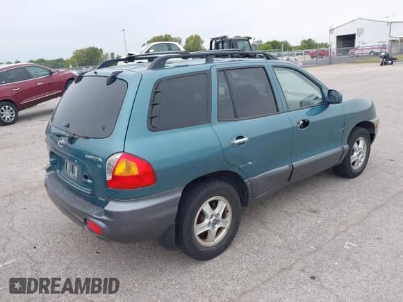 2003 Hyundai Santa Fe GLS with VIN KM8SC73D53U359974, listed as a IAAI auction lot 43279141 with 159,607 mi miles and . Bid and sale history available at DreamBid. Image 4.