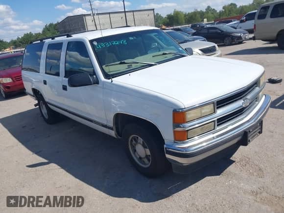 1999 Chevrolet Suburban z VIN 3GNEC16R8XG124569, wystawiony jako IAAI lot #43317248 z przebiegiem 254 826 mil mil oraz . Historia ofert i sprzedaży dostępna na DreamBid. Obrazek 1.