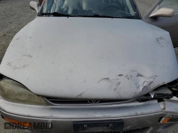 1996 Toyota Camry DX z VIN JT2BG12K9T0371115, wystawiony jako Copart lot #70061945 z przebiegiem 274 613 mil mil oraz Szkoda całkowita • Salvage title. Historia ofert i sprzedaży dostępna na DreamBid. Obrazek 11.