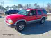 1999 Chevrolet Blazer LS z VIN 1GNDT13W2X2163804, wystawiony jako IAAI lot #41527624 z przebiegiem 185 151 mil mil oraz . Historia ofert i sprzedaży dostępna na DreamBid. Obrazek 2.