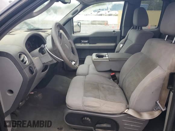 2005 Ford F-150 XLT with VIN 1FTPX12595NA46140, listed as a Copart auction lot 82141515 with 156,879 mi miles and Salvage title. Bid and sale history available at DreamBid. Image 7.