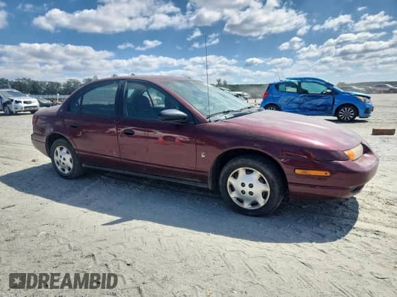 2002 Saturn SL with VIN 1G8ZG52882Z192053, listed as a Copart auction lot 68711695 with 309,633 mi miles and Salvage title. Bid and sale history available at DreamBid. Image 4.