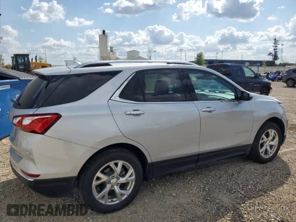 2020 Chevrolet Equinox Premier z VIN 2GNAXXEV1L6222160, wystawiony jako Copart lot #70782845 z przebiegiem 33 951 mil mil oraz Szkoda całkowita • Salvage title. Historia ofert i sprzedaży dostępna na DreamBid. Obrazek 3.