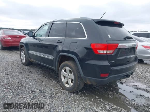 2012 Jeep Grand Cherokee Laredo z VIN 1C4RJEAG1CC229237, wystawiony jako IAAI lot #41613422 z przebiegiem 206 633 mil mil oraz . Historia ofert i sprzedaży dostępna na DreamBid. Obrazek 3.