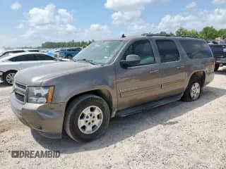 2013 Chevrolet Suburban LT with VIN 1GNSCJE01DR330091, listed as a Copart auction lot 70826395 with 187,683 mi miles and Salvage title. Bid and sale history available at DreamBid. Image 1.