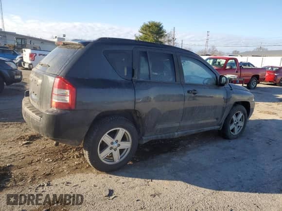 2010 Jeep Compass Sport z VIN 1J4NT1FB8AD671108, wystawiony jako Copart lot #82151454 z przebiegiem 206 413 mil mil oraz Szkoda całkowita • Salvage title. Historia ofert i sprzedaży dostępna na DreamBid. Obrazek 3.