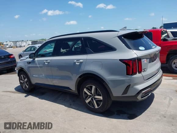 2023 Kia Sorento EX with VIN 5XYRH4LF5PG228054, listed as a IAAI auction lot 42641510 with 16,596 mi miles and . Bid and sale history available at DreamBid. Image 14.
