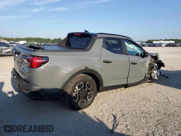2023 Hyundai Santa Cruz SEL с VIN 5NTJCDAE7PH076424, выставлен на аукционе Copart как лот 81056155 с пробегом 23 761 миль миль и На запчасти • Non repairable. История ставок и продаж доступна на DreamBid. Изображение 3.