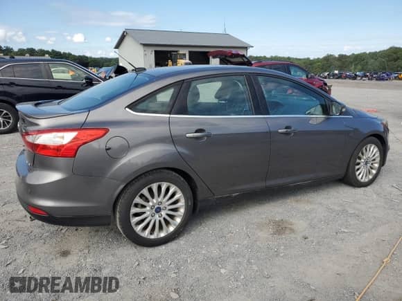 2012 Ford Focus Titanium with VIN 1FAHP3J27CL412974, listed as a Copart auction lot 69800475 with 95,073 mi miles and Salvage title. Bid and sale history available at DreamBid. Image 3.