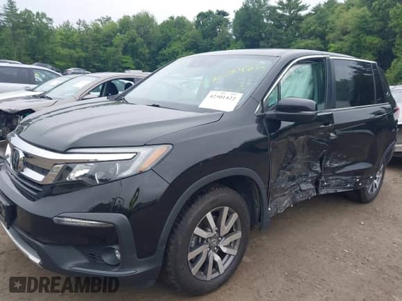 2019 Honda Pilot EX-L z VIN 5FNYF6H51KB061852, wystawiony jako IAAI lot #42501422 z przebiegiem 95 258 mil mil oraz . Historia ofert i sprzedaży dostępna na DreamBid. Obrazek 2.