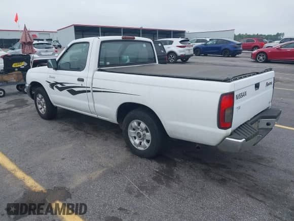 2000 Nissan Frontier XE with VIN 1N6DD21S5YC305132, listed as a IAAI auction lot 42695081 with 111,427 mi miles and . Bid and sale history available at DreamBid. Image 3.