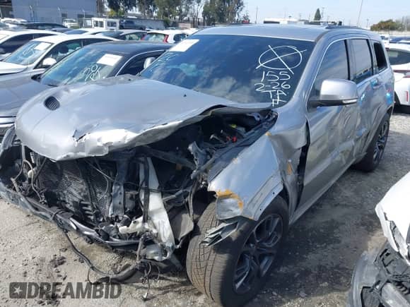 2015 Jeep Grand Cherokee SRT z VIN 1C4RJFDJ0FC237833, wystawiony jako IAAI lot #41342190 z przebiegiem 129 518 mil mil oraz . Historia ofert i sprzedaży dostępna na DreamBid. Obrazek 2.