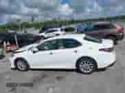 2021 Toyota Camry LE with VIN 4T1C11AK8MU601313, listed as a IAAI auction lot 43383218 with 34,384 mi miles and . Bid and sale history available at DreamBid. Image 14.