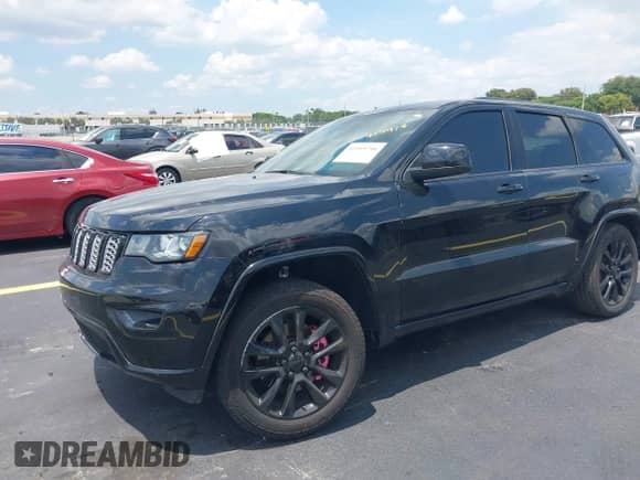 2021 Jeep Grand Cherokee Laredo E with VIN 1C4RJEAG7MC844473, listed as a IAAI auction lot 42319716 with 90,449 mi miles and . Bid and sale history available at DreamBid. Image 18.