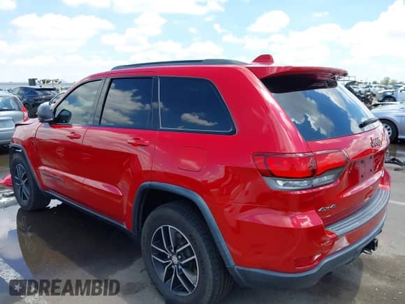 2018 Jeep Grand Cherokee Trailhawk z VIN 1C4RJFLG3JC399051, wystawiony jako IAAI lot #42359437 z przebiegiem 70 956 mil mil oraz . Historia ofert i sprzedaży dostępna na DreamBid. Obrazek 3.