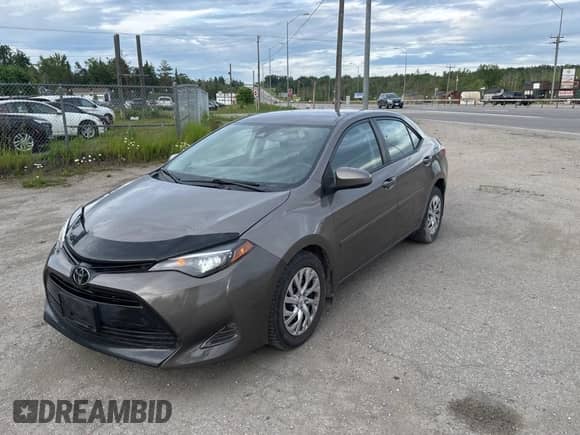 2019 Toyota Corolla L with VIN 2T1BURHE5KC220051, listed as a Copart auction lot 61879415 with 196,200 mi miles and Clean title. Bid and sale history available at DreamBid. Image 2.