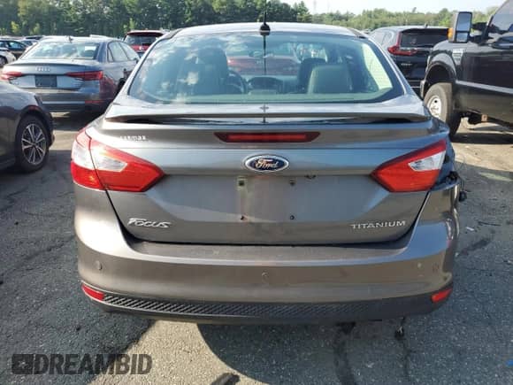 2013 Ford Focus Titanium with VIN 1FADP3J29DL129007, listed as a Copart auction lot 66289165 with 72,489 mi miles and Salvage title. Bid and sale history available at DreamBid. Image 6.