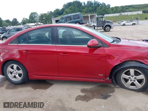 2012 Chevrolet Cruze 1LT z VIN 1G1PF5SC6C7216165, wystawiony jako IAAI lot #42937159 z przebiegiem 188 366 mil mil oraz . Historia ofert i sprzedaży dostępna na DreamBid. Obrazek 13.