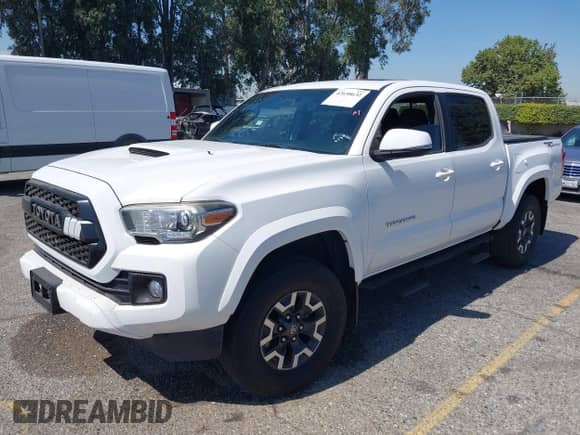 2017 Toyota Tacoma SR5 with VIN 3TMAZ5CN1HM037971, listed as a IAAI auction lot 42658632 with 67,228 mi miles and . Bid and sale history available at DreamBid. Image 2.