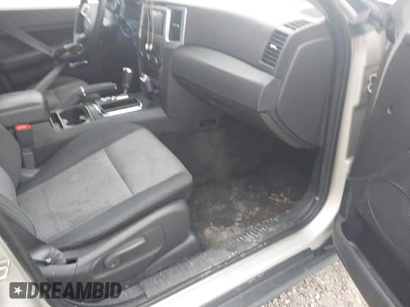 2009 Jeep Grand Cherokee Laredo with VIN 1J8GS48K09C538319, listed as a IAAI auction lot 43363239 with 248,676 mi miles and . Bid and sale history available at DreamBid. Image 5.