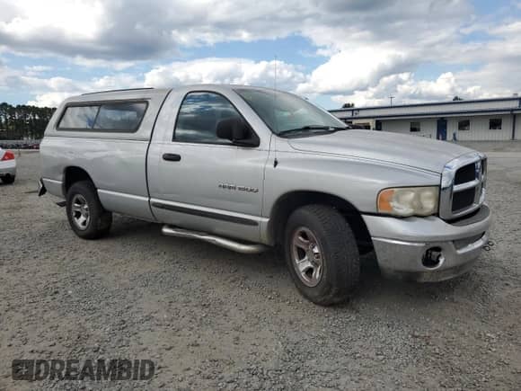 2005 Dodge 1500 ST with VIN 1D7HA16K35J551173, listed as a Copart auction lot 69730475 with 221,914 mi miles and Salvage title. Bid and sale history available at DreamBid. Image 4.