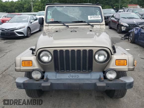 2004 Jeep Wrangler Sahara с VIN 1J4FA59S84P801582, выставлен на аукционе Copart как лот 64183535 с пробегом 127 213 миль миль и Списание • Salvage title. История ставок и продаж доступна на DreamBid. Изображение 5.