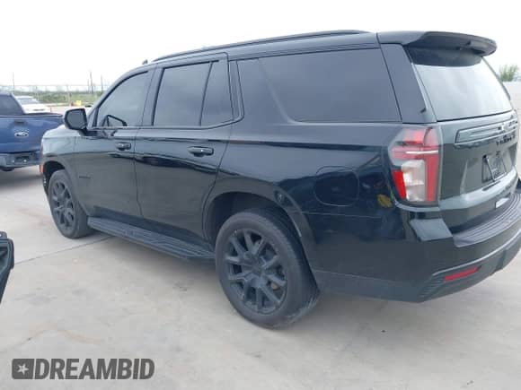 2023 Chevrolet Tahoe RST with VIN 1GNSCRKDXPR282973, listed as a IAAI auction lot 39018448 with 33,385 mi miles and . Bid and sale history available at DreamBid. Image 3.