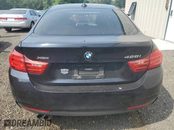 2015 BMW 4 Series 428i xDrive z VIN WBA4C9C58FD330455, wystawiony jako Copart lot #60933335 z przebiegiem 146 776 mil mil oraz Szkoda całkowita • Salvage title. Historia ofert i sprzedaży dostępna na DreamBid. Obrazek 6.