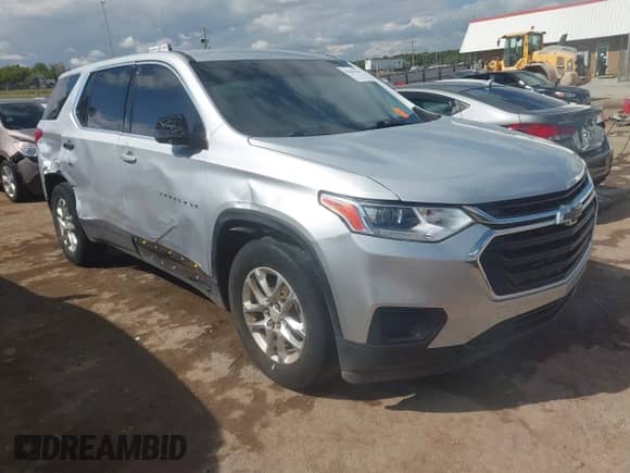 2019 Chevrolet Traverse LS z VIN 1GNERFKW7KJ186981, wystawiony jako IAAI lot #43303144 z przebiegiem 130 898 mil mil oraz . Historia ofert i sprzedaży dostępna na DreamBid. Obrazek 1.