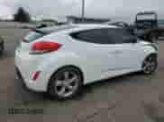 2015 Hyundai Veloster z VIN KMHTC6ADXFU226603, wystawiony jako Copart lot #83825545 z przebiegiem 136 233 mil mil oraz Szkoda całkowita • Salvage title. Historia ofert i sprzedaży dostępna na DreamBid. Obrazek 3.