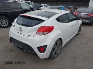 2014 Hyundai Veloster Turbo z VIN KMHTC6AE1EU182501, wystawiony jako IAAI lot #43333749 z przebiegiem 157 957 mil mil oraz . Historia ofert i sprzedaży dostępna na DreamBid. Obrazek 4.