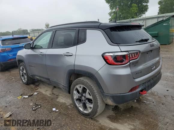 2019 Jeep Compass Trailhawk with VIN 3C4NJDDB7KT671080, listed as a Copart auction lot 60645655 with 131,581 mi miles and Salvage title. Bid and sale history available at DreamBid. Image 2.