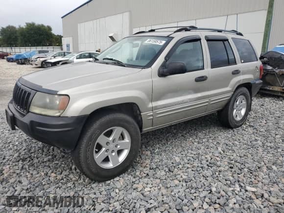 2004 Jeep Grand Cherokee Laredo with VIN 1J4GX48S04C301566, listed as a Copart auction lot 86159575 with 195,483 mi miles and Salvage title. Bid and sale history available at DreamBid. Image 1.