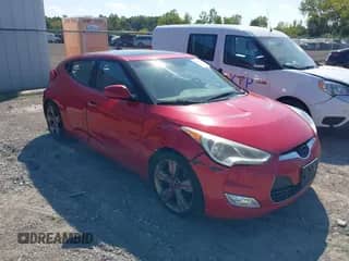 2012 Hyundai Veloster w/Gray Int z VIN KMHTC6AD3CU021409, wystawiony jako IAAI lot #43181633 z przebiegiem 149 988 mil mil oraz . Historia ofert i sprzedaży dostępna na DreamBid. Obrazek 1.