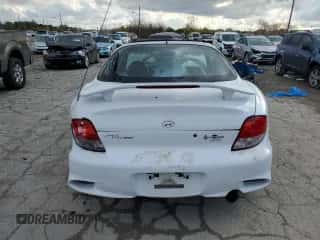 2000 Hyundai Tiburon с VIN KMHJG35F9YU191917, выставлен на аукционе Copart как лот 79629394 с пробегом 179 948 миль миль и Списание • Salvage title. История ставок и продаж доступна на DreamBid. Изображение 6.