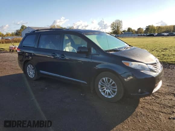 2012 Toyota Sienna XLE with VIN 5TDYK3DC5CS245235, listed as a Copart auction lot 82349425 with 149,275 mi miles and Salvage title. Bid and sale history available at DreamBid. Image 4.
