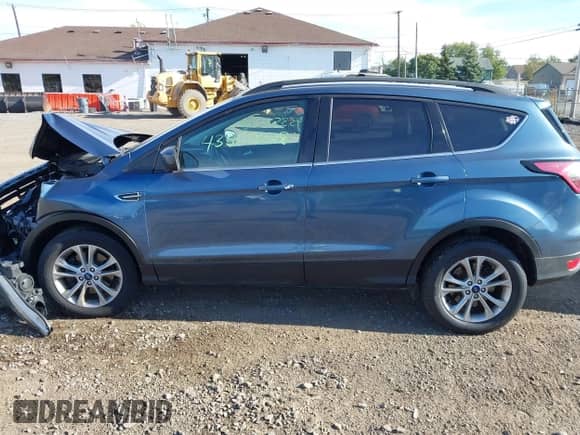 2018 Ford Escape SE with VIN 1FMCU9GD3JUB69434, listed as a IAAI auction lot 43352228 with 63,274 mi miles and . Bid and sale history available at DreamBid. Image 14.