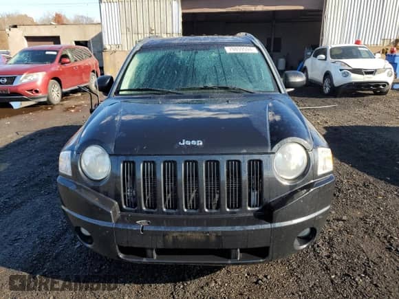 2010 Jeep Compass Sport z VIN 1J4NT1FB3AD641479, wystawiony jako Copart lot #79859594 z przebiegiem 173 768 mil mil oraz Szkoda całkowita • Salvage title. Historia ofert i sprzedaży dostępna na DreamBid. Obrazek 5.