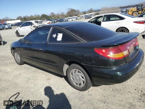 1997 Saturn SC with VIN 1G8ZF1286VZ266912, listed as a Copart auction lot 46953875 with 149,017 mi miles and Salvage title. Bid and sale history available at DreamBid. Image 2.