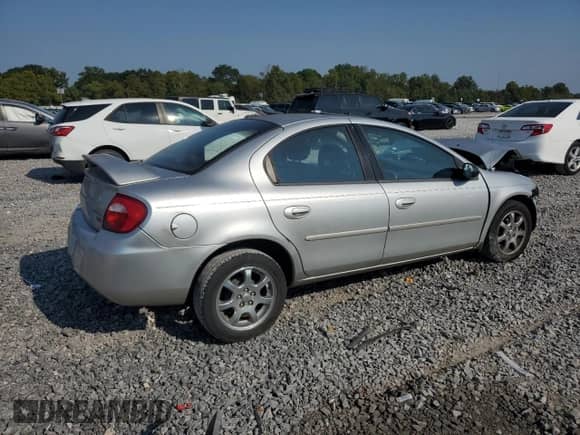 2004 Dodge Neon SXT with VIN 1B3ES56C94D560985, listed as a Copart auction lot 71305465 with 44,077 mi miles and Salvage title. Bid and sale history available at DreamBid. Image 3.