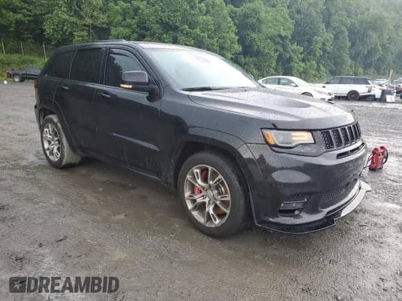 2018 Jeep Grand Cherokee SRT with VIN 1C4RJFDJ7JC212775, listed as a Copart auction lot 60243165 with Not provided miles and Salvage title. Bid and sale history available at DreamBid. Image 4.