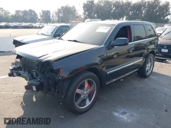 2009 Jeep Grand Cherokee with VIN 1J8HR78W49C550879, listed as a IAAI auction lot 41279386 with 126,314 mi miles and . Bid and sale history available at DreamBid. Image 18.