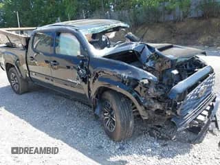 2021 Toyota Tacoma SR5 z VIN 3TYDZ5BN1MT002778, wystawiony jako IAAI lot #42591088 z przebiegiem Nie podano mil oraz . Historia ofert i sprzedaży dostępna na DreamBid. Obrazek 1.