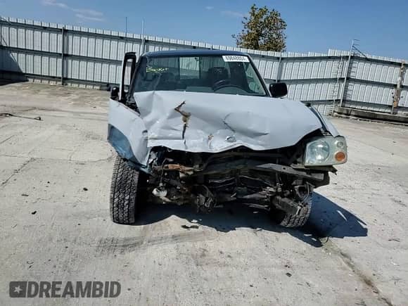 2003 Nissan Frontier XE с VIN 1N6ED26Y03C462996, выставлен на аукционе Copart как лот 69848804 с пробегом Не указан миль и Списание • Salvage title. История ставок и продаж доступна на DreamBid. Изображение 10.
