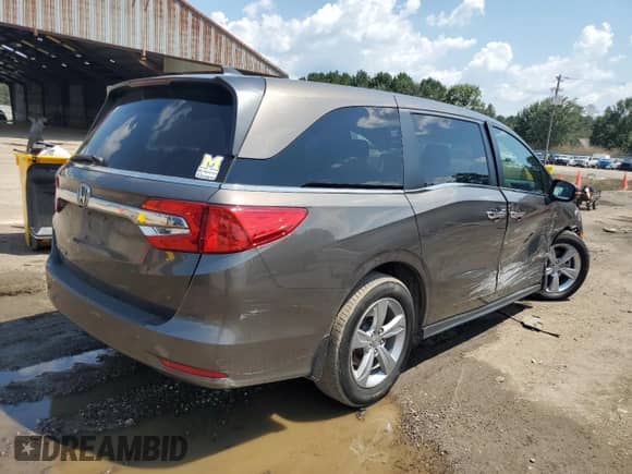 2020 Honda Odyssey EX-L with VIN 5FNRL6H70LB073801, listed as a Copart auction lot 69287415 with 117,518 mi miles and Salvage title. Bid and sale history available at DreamBid. Image 3.