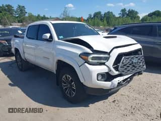 2021 Toyota Tacoma SR with VIN 3TYCZ5ANXMT013842, listed as a IAAI auction lot 42561330 with 71,552 mi miles and . Bid and sale history available at DreamBid. Image 1.