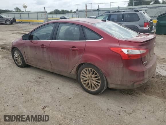 2014 Ford Focus Titanium with VIN 1FADP3J28EL431275, listed as a Copart auction lot 83947635 with 212,537 mi miles and Salvage title. Bid and sale history available at DreamBid. Image 2.