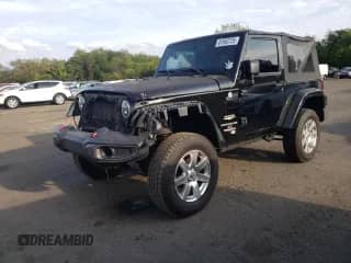 2014 Jeep Wrangler Sahara z VIN 1C4AJWBG0EL125620, wystawiony jako Copart lot #81502725 z przebiegiem 143 297 mil mil oraz Szkoda całkowita • Salvage title. Historia ofert i sprzedaży dostępna na DreamBid. Obrazek 1.