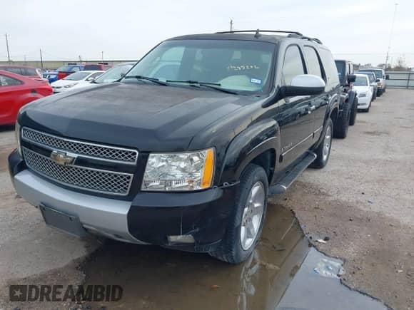 2008 Chevrolet Tahoe LTZ with VIN 1GNFC13068R250019, listed as a IAAI auction lot 41295202 with 143,839 mi miles and . Bid and sale history available at DreamBid. Image 2.